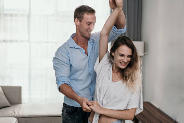 Intimate couple dancing at home - Foto, afbeelding