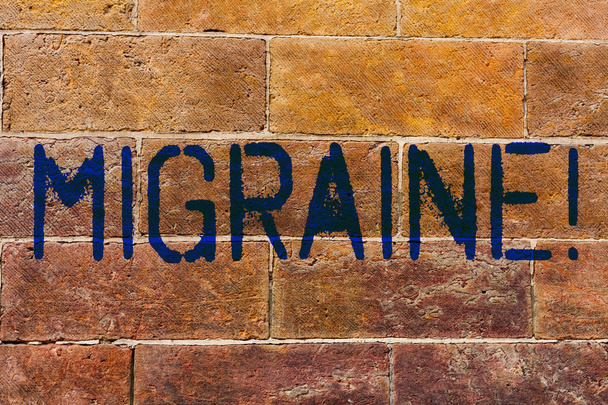 Conceptual hand writing showing Migraine. Business photo showcasing Recurrent headache in one side of head nausea and disturbed vision Brick Wall art like Graffiti motivational written on wall. - Photo, Image