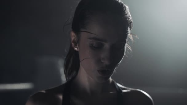 Young boxer girl with boxing gloves screams emotionally standing on the boxing ring. Slow motion - Felvétel, videó