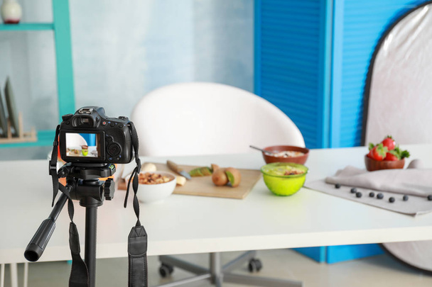 Workplace of food blogger with modern camera - Foto, Imagem