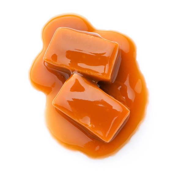 Tasty caramel candies on white background - Photo, Image