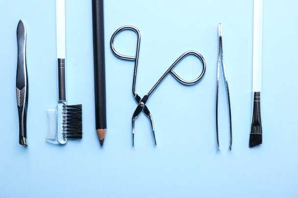Set of tools for eyebrows correction on color background - Foto, Imagem