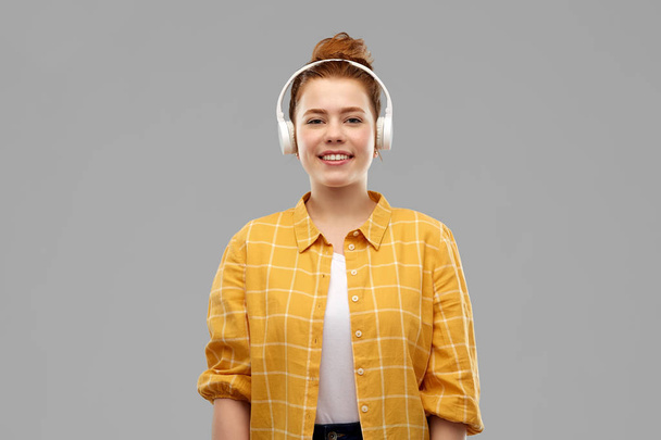 teenage girl in headphones listening to music - Photo, Image
