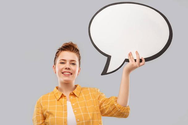red haired teenage girl holding speech bubble - Фото, изображение