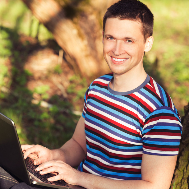 outdoors portrait men with laptop - Fotó, kép