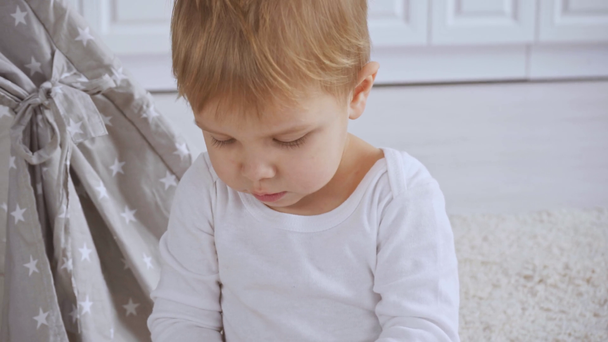 cute emotional toddler boy holding color pencils - Footage, Video