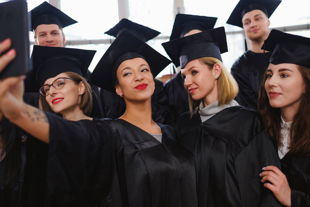 Multi ethnic group of graduated students taking selfie - Foto, Imagem