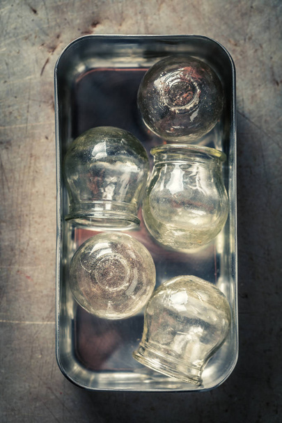 Retro medical cupping glass in a stainless steel container - Φωτογραφία, εικόνα