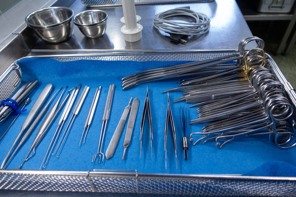 unsorted surgical instruments after cleaning in the washing mach - Foto, Imagem