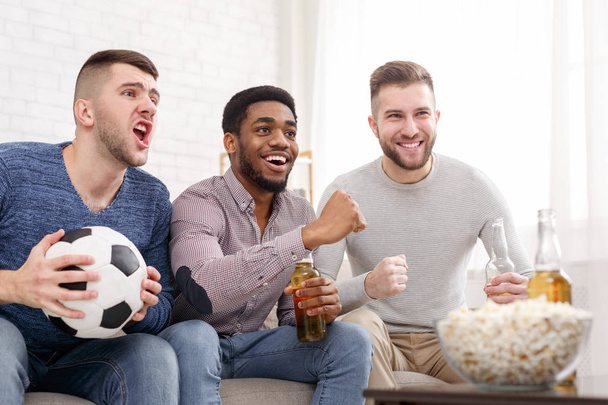 Men watching football match, cheering for favourite team - Fotoğraf, Görsel