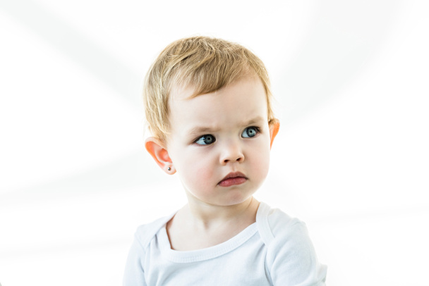 thoughtful baby with blonde hair looking away isolated on white - Foto, afbeelding