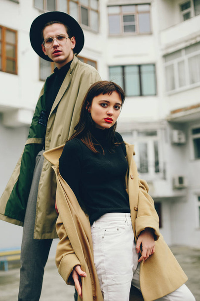 A trendy couple in a gloomy city - Zdjęcie, obraz