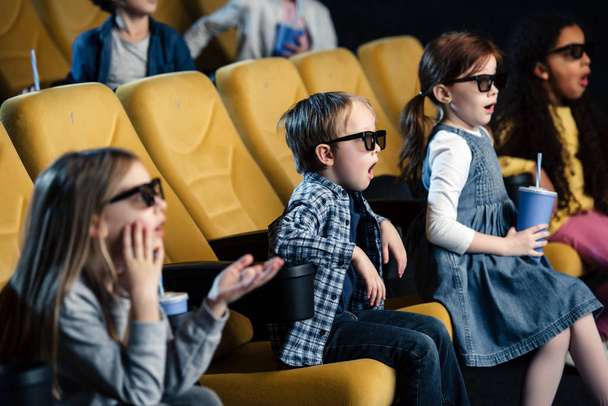 excited multicultural friends in 3d glasses watching movie in cinema - Photo, Image