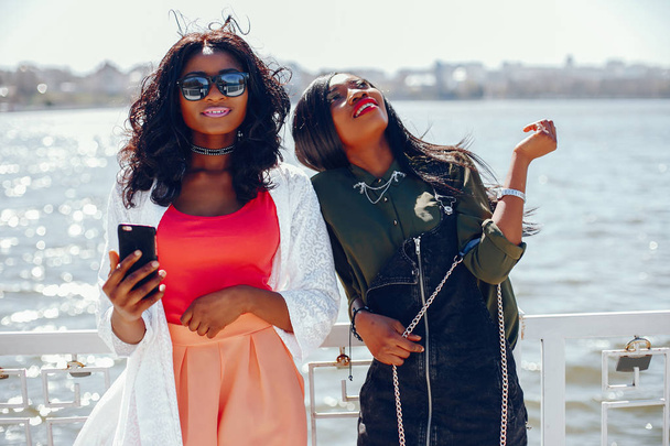 fashionable black girls in a park - Фото, изображение