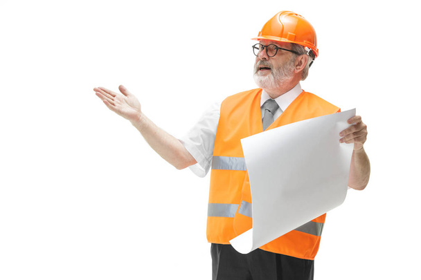 The builder in orange helmet isolated on white - 写真・画像