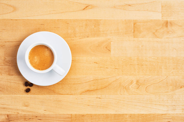 Cup of coffee or espresso on wooden table - 写真・画像