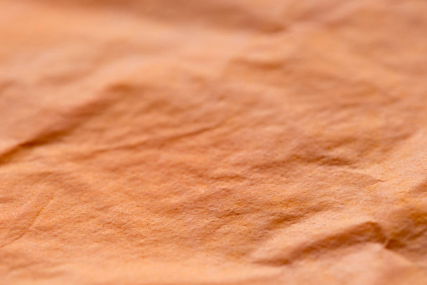 orange creased tissue papet background texture selective focus m - Photo, Image