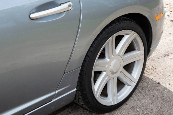 Sporty car wheel rear view of grey sport car - Foto, Imagem