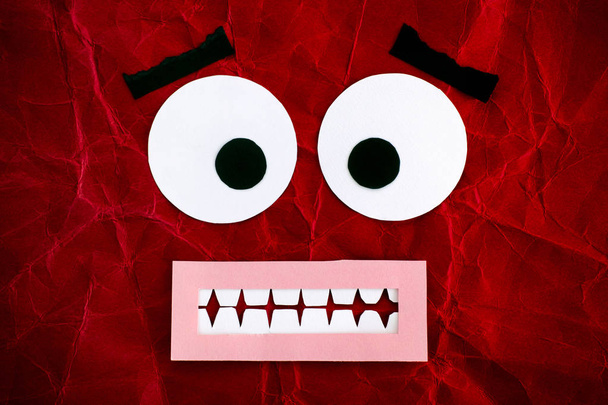 Scared emotional face made from red paper.  - Foto, Imagem