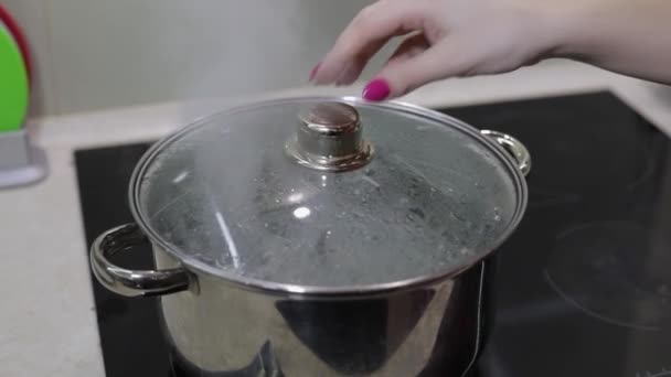 food cooking. meal preparation at kitchen. pan with boiling water - Footage, Video