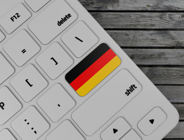 Γερμανική σημαία εισάγετε το κλειδί στο λευκό πληκτρολόγιο PC, σε φόντο ξύλου. απόδοση 3D - Φωτογραφία, εικόνα