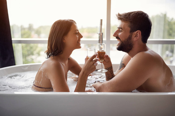 Couple in love spending time together. Romantic moments in the bathroom - Fotografie, Obrázek