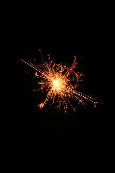 yellow sparks on a black background - Foto, immagini