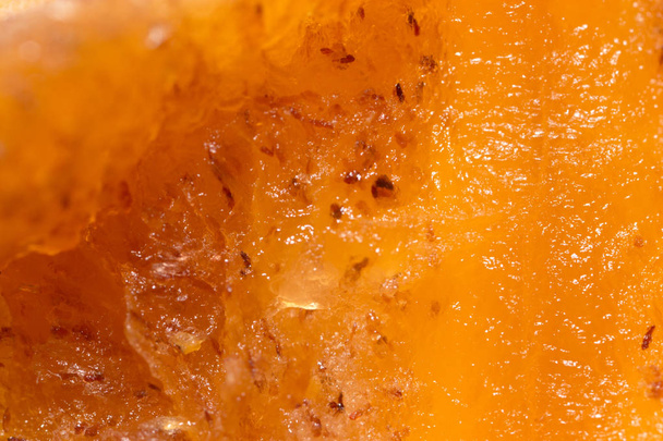 pulp ripe persimmons as a background. macro - 写真・画像