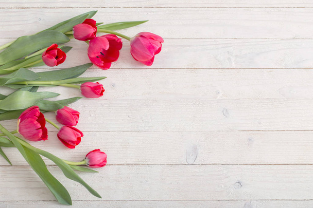 pink tulips on white wooden background - Zdjęcie, obraz