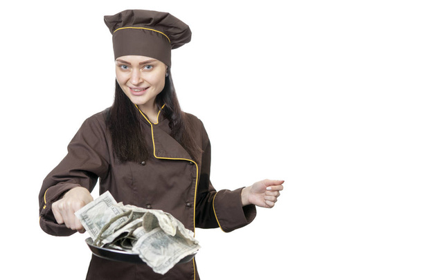 Chef offers dollars on a frying pan - Фото, зображення