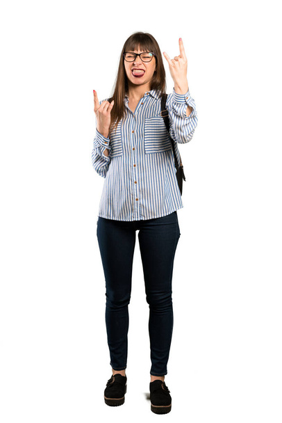 Full-length shot of Woman with glasses making rock gesture - Photo, image