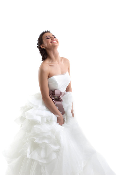Smiling brunette posing in wedding dress - Valokuva, kuva