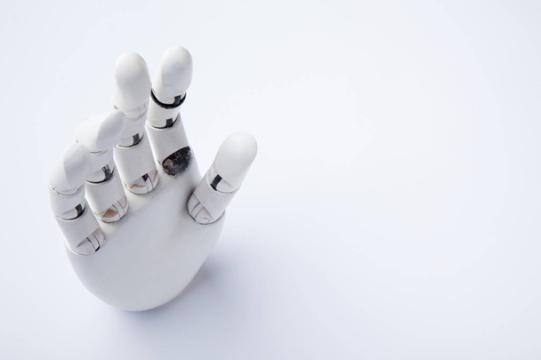 Hand of an artificial intelligence robot on a white background. - 写真・画像