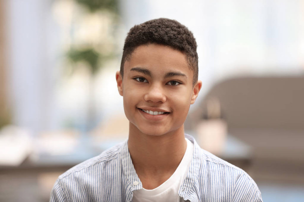 Portrait of African-American teenage boy at home - Φωτογραφία, εικόνα