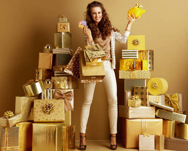 shopper woman with shopping bags, credit cards showing yellow pi - Fotoğraf, Görsel
