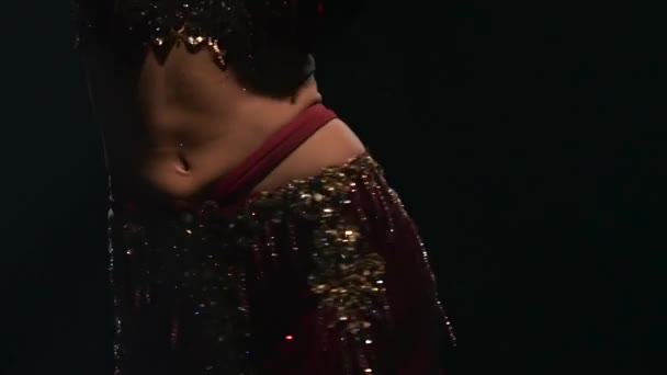 Girl torso traditional oriental belly dancer. Black background. Slow motion. Close up - Materiaali, video