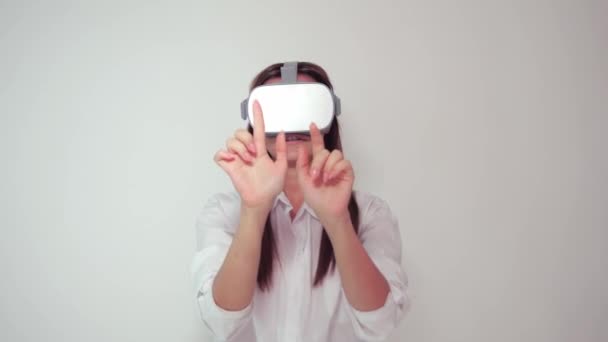 Young hip woman wearing VR 360 goggles pressing objects - Metraje, vídeo