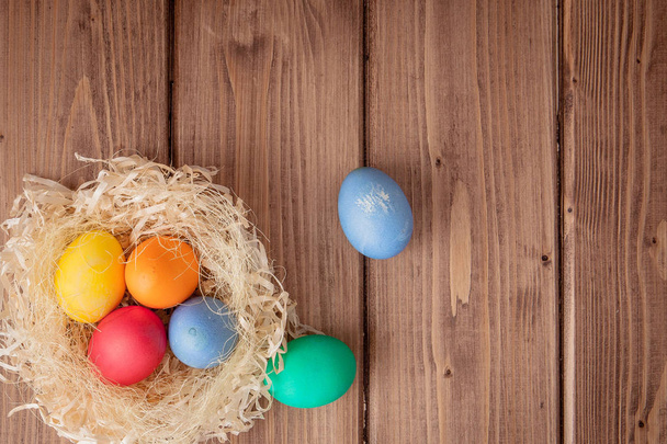 Colorful Easter eggs on wooden background with copy space - Фото, зображення