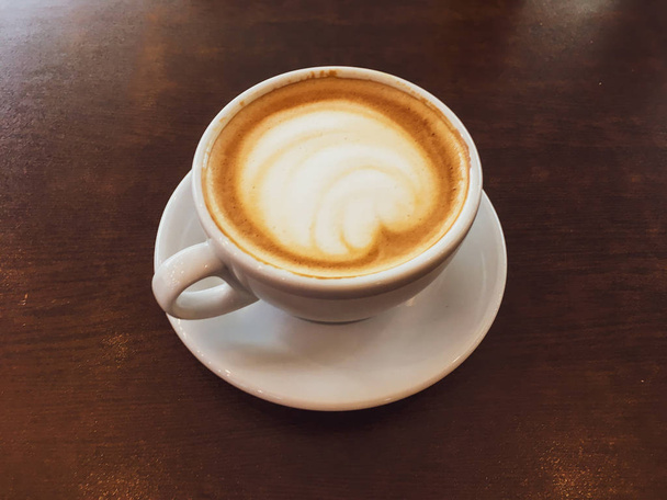 Cappuccino in a restaurant, at a coffee break - Fotoğraf, Görsel