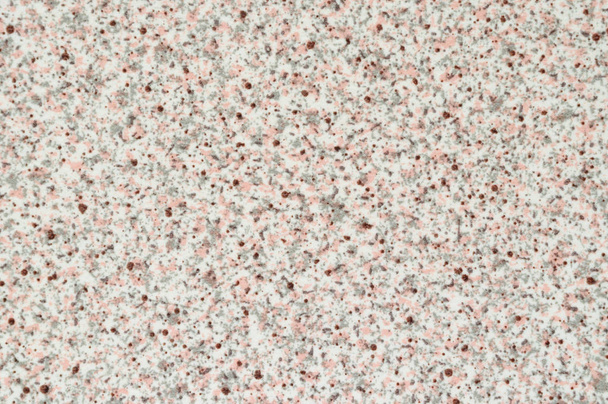 Υφή του πλαστικού με απομίμηση της άσπρης πέτρας με γκρι και ροζ εγκλείσματα. - Φωτογραφία, εικόνα