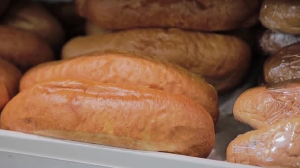 Ruddy pastries on the display in the grocery store. - Footage, Video