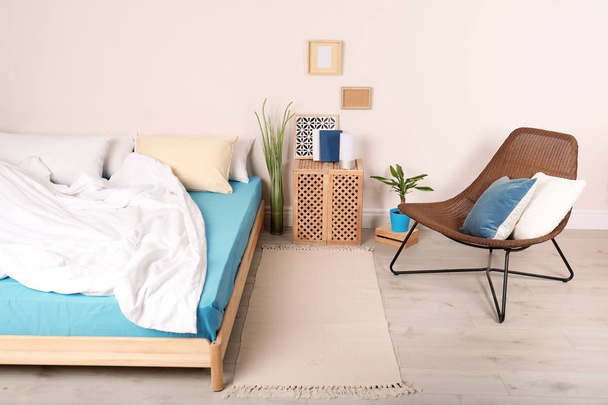 Modern bedroom interior with comfortable chair. Stylish design - Foto, immagini