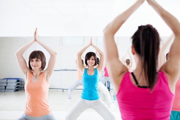 Young Women Doing Exercises - Foto, immagini