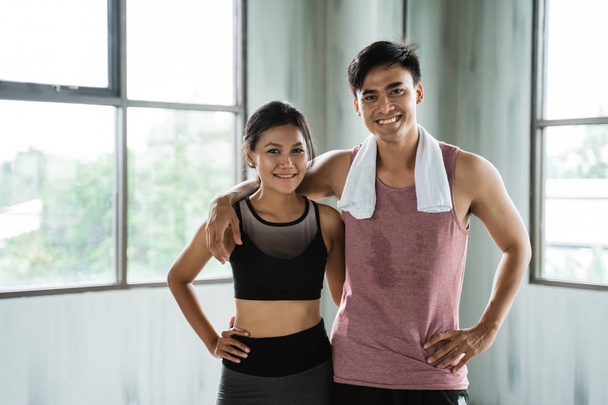 sporty couple hands on the waist at the gym hall  - Φωτογραφία, εικόνα