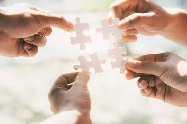 Business people group holding jigsaw puzzle.  - Foto, immagini