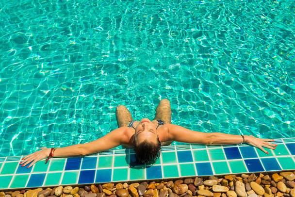 woman in luxury spa resort near the swimming pool.  - Fotoğraf, Görsel