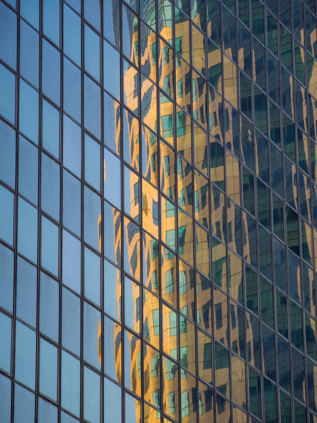 Skyscraper reflections on the windows in  - Valokuva, kuva