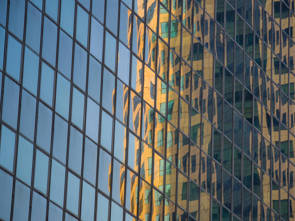 Skyscraper reflections on the windows in  - Foto, afbeelding