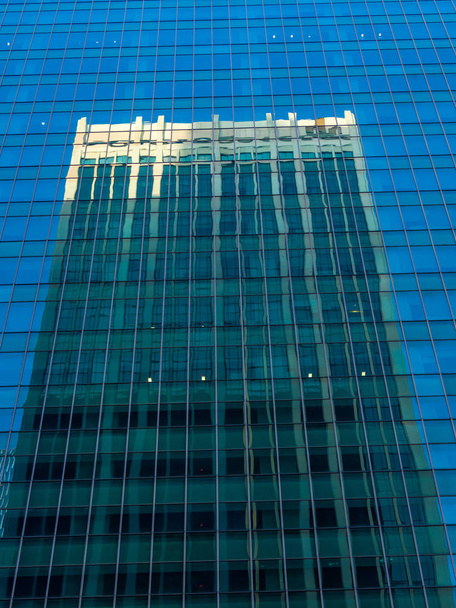 Skyscraper reflections on the windows in  - Foto, afbeelding