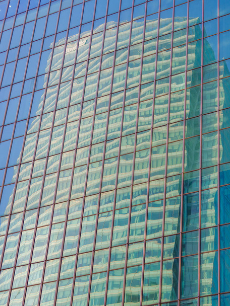 Skyscraper reflections on the windows in  - Фото, зображення